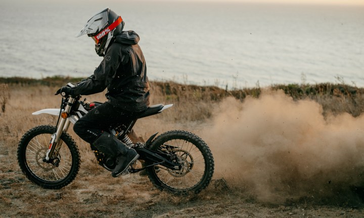 Alt text: Rider on a Zero XB motorcycle kicking up dust on a dirt trail.