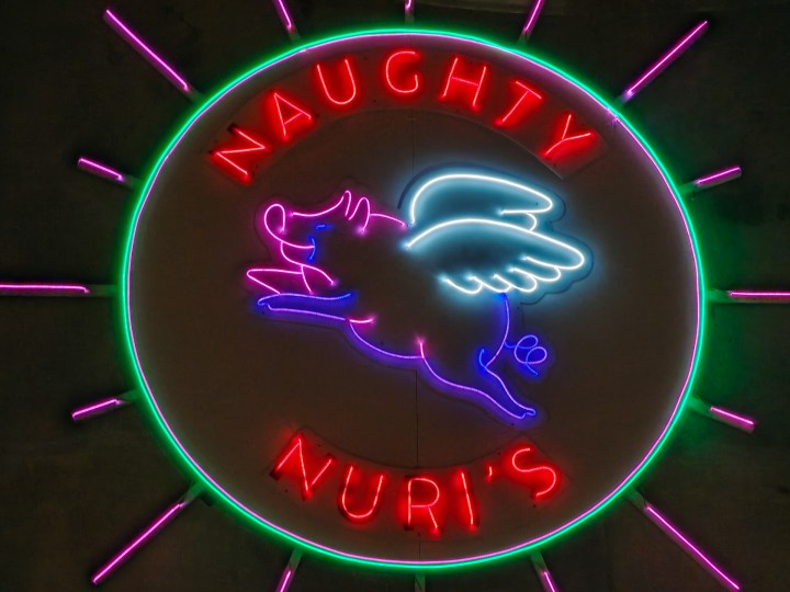 Low-light zoomed photo of a neon sign taken with the Find X8 Pro