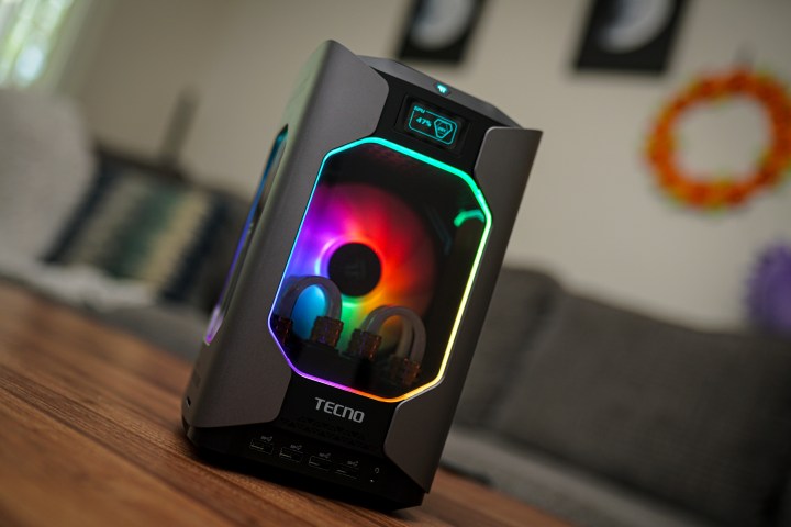 The Tecno Megamini G1 gaming PC sitting on a coffee table.