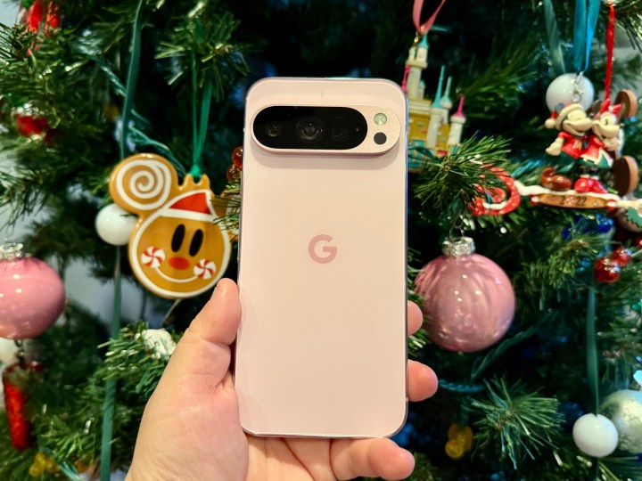 Rose Quartz Pixel 9 Pro in front of a Christmas tree.