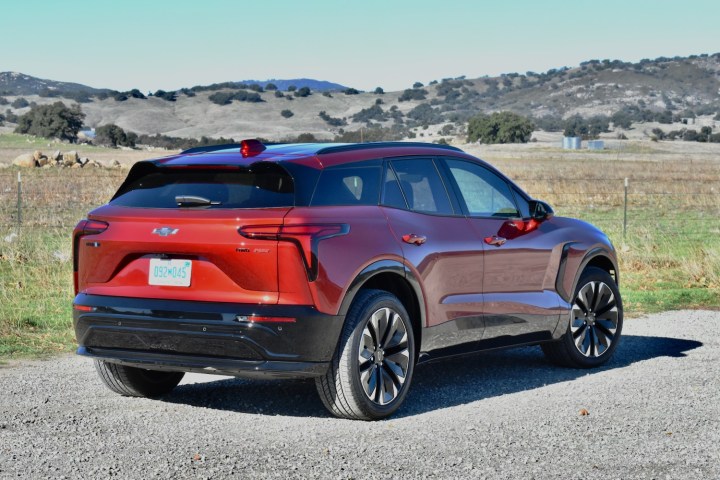 alt: Rear three-quarter view of the 2024 Chevrolet Blazer EV RS, emphasizing its SUV styling and proportions.