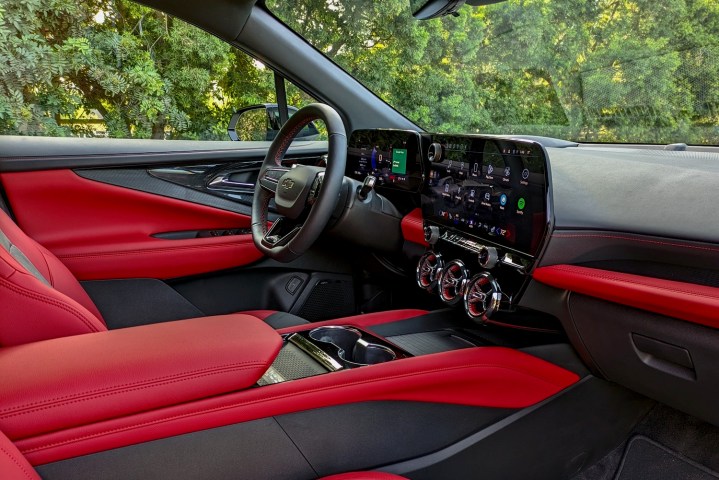 alt: Interior view of the 2024 Chevrolet Blazer EV RS, showcasing its red leather upholstery and unique design elements.