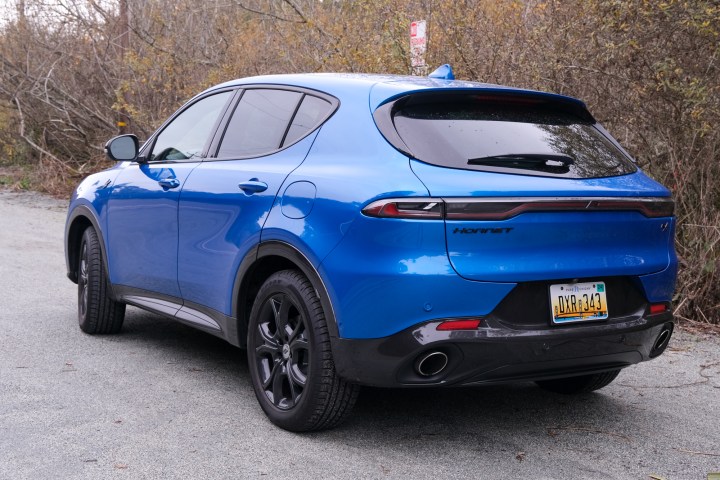 A rear three-quarter view of a blue Dodge Hornet R/T.