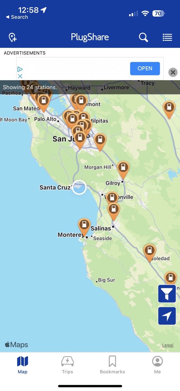 alt: The PlugShare app displays nearby EV charging stations on a map view.