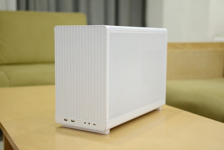 The Lian Li A3-mATX case in white placed on a table.