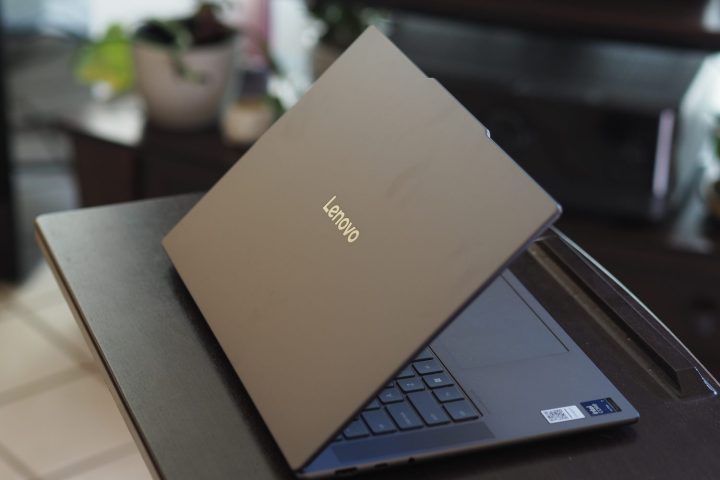 alt text: The rear view of the Lenovo Yoga Slim 7i Aura Edition highlighting its lid design and logo.