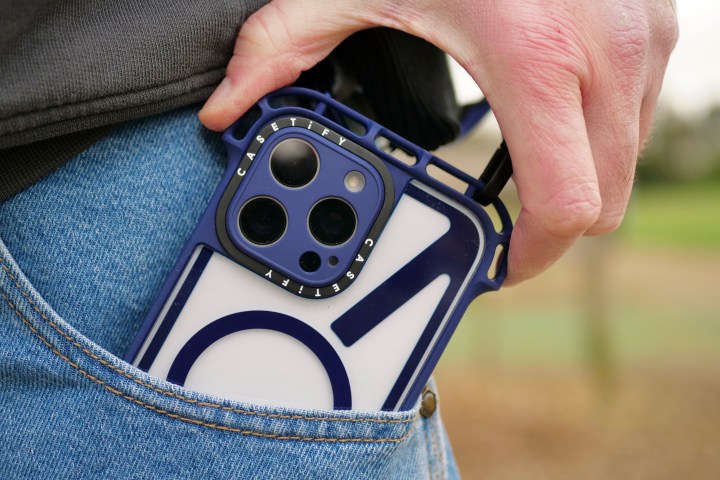 A person holding an iPhone 16 Pro Max in a Casetify Ultra Bounce case.