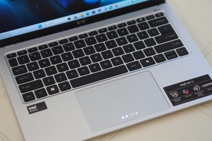 alt text: Top-down view of the Acer Swift Go 14 laptop open, showcasing its keyboard and touchpad.