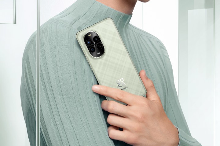 A promotional image showing a person holding the Huawei Nova 13.