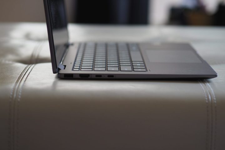 alt text: Side view of the closed HP Envy x360 14, showcasing its slim profile and port placement.