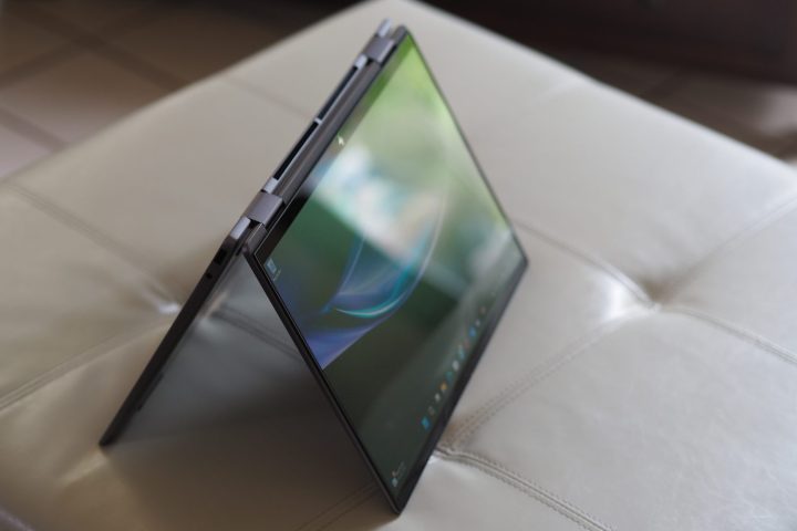 alt text: HP Envy x360 14 (2024) in tent mode, showcasing the flexibility of its 2-in-1 design and the vibrant OLED display.