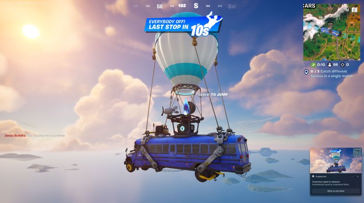 Alt: The iconic Fortnite Battle Bus against a vibrant sky.