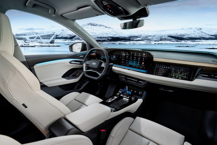 alt: The interior of the 2025 Audi Q6 e-tron, showcasing the advanced digital dashboard and infotainment system.