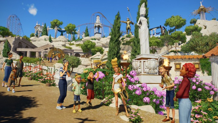 Guests with a mythology entertainer in Planet Coaster 2.