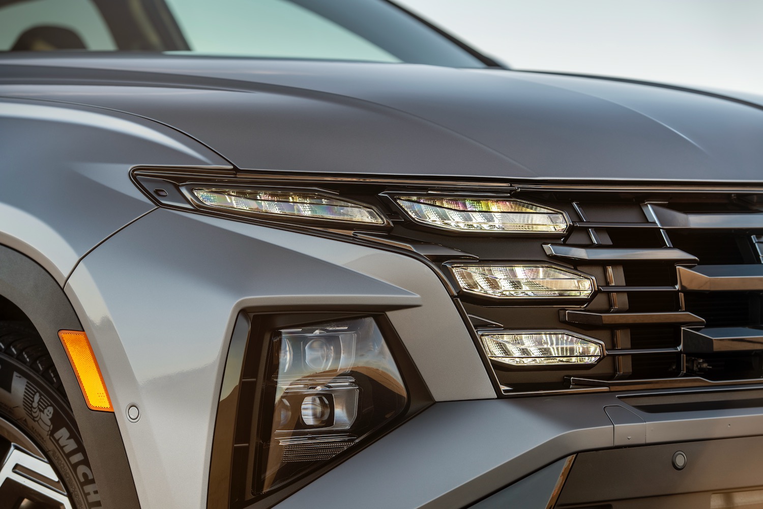 Close-up view of the 2025 Hyundai Tucson Plug-In Hybrid headlight.