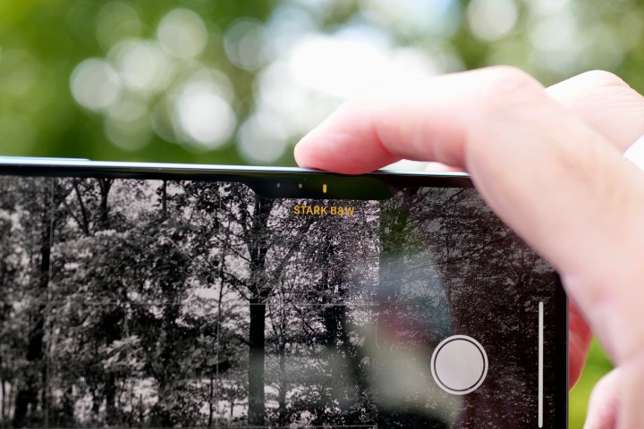 A person using the Camera Control on the Apple iPhone 16 Plus.