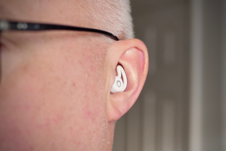 A person wearing the Ozlo Sleepbuds.