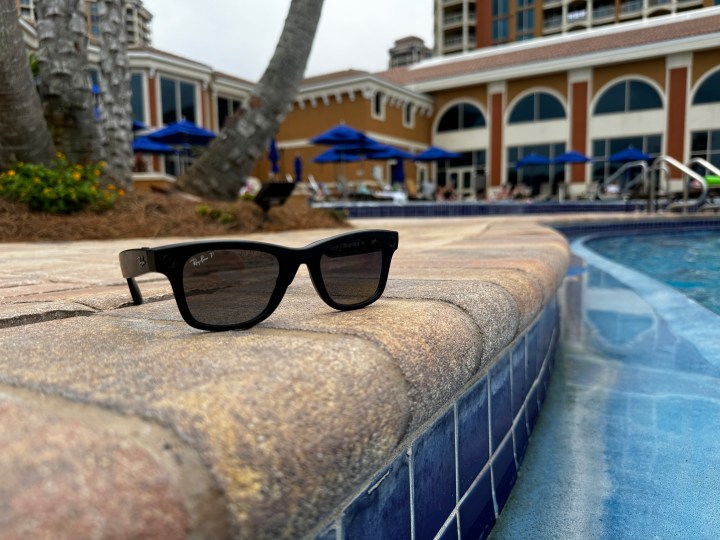 Ray-Ban Meta smart glasses by a pool.