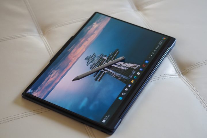 alt text: Lenovo Yoga 9i Gen 9 in tablet mode with the included active pen, illustrating its versatility for note-taking and drawing.