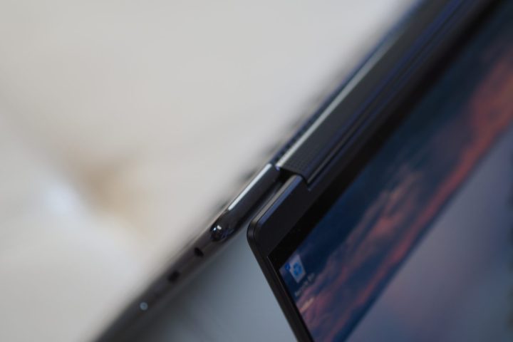 alt text: Close-up view of the Lenovo Yoga 9i Gen 9 in tent mode, highlighting the edge of the display and the hinge mechanism.