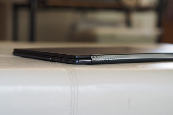 alt text: Side view of the Lenovo Yoga 9i Gen 9's rear edge, showcasing its slim profile.