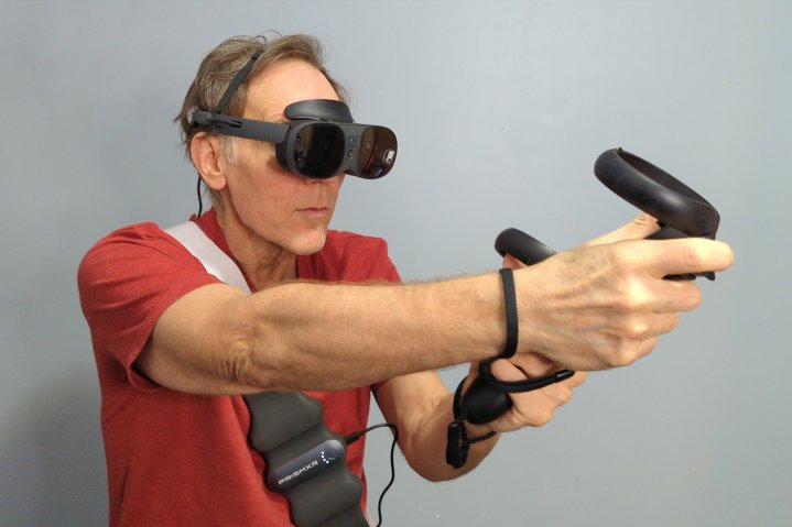 alt text: The HTC Vive XR Elite in glasses mode with an external battery belt for standalone gaming.