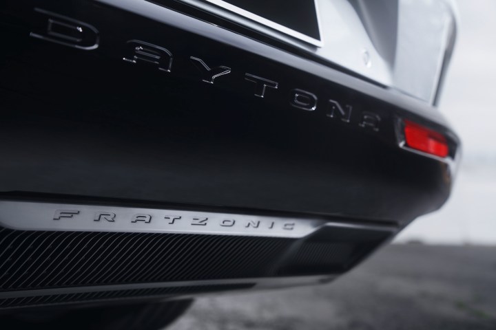 alt: The 2024 Dodge Charger Daytona in motion, emphasizing its sporty profile.