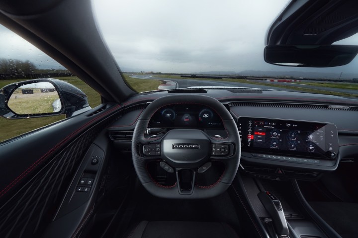 alt: Interior of the 2024 Dodge Charger Daytona, highlighting the 12.3-inch touchscreen and modern dashboard.