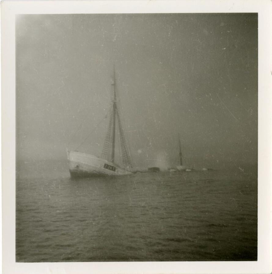 The final photo of the Quest as it sank beneath the surface in the Labrador Sea. This image marks the end of the ship's journey.