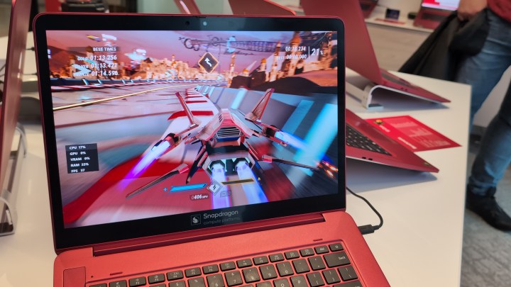 alt text: A racing game displayed on the screen of a Qualcomm Snapdragon X Elite reference laptop.