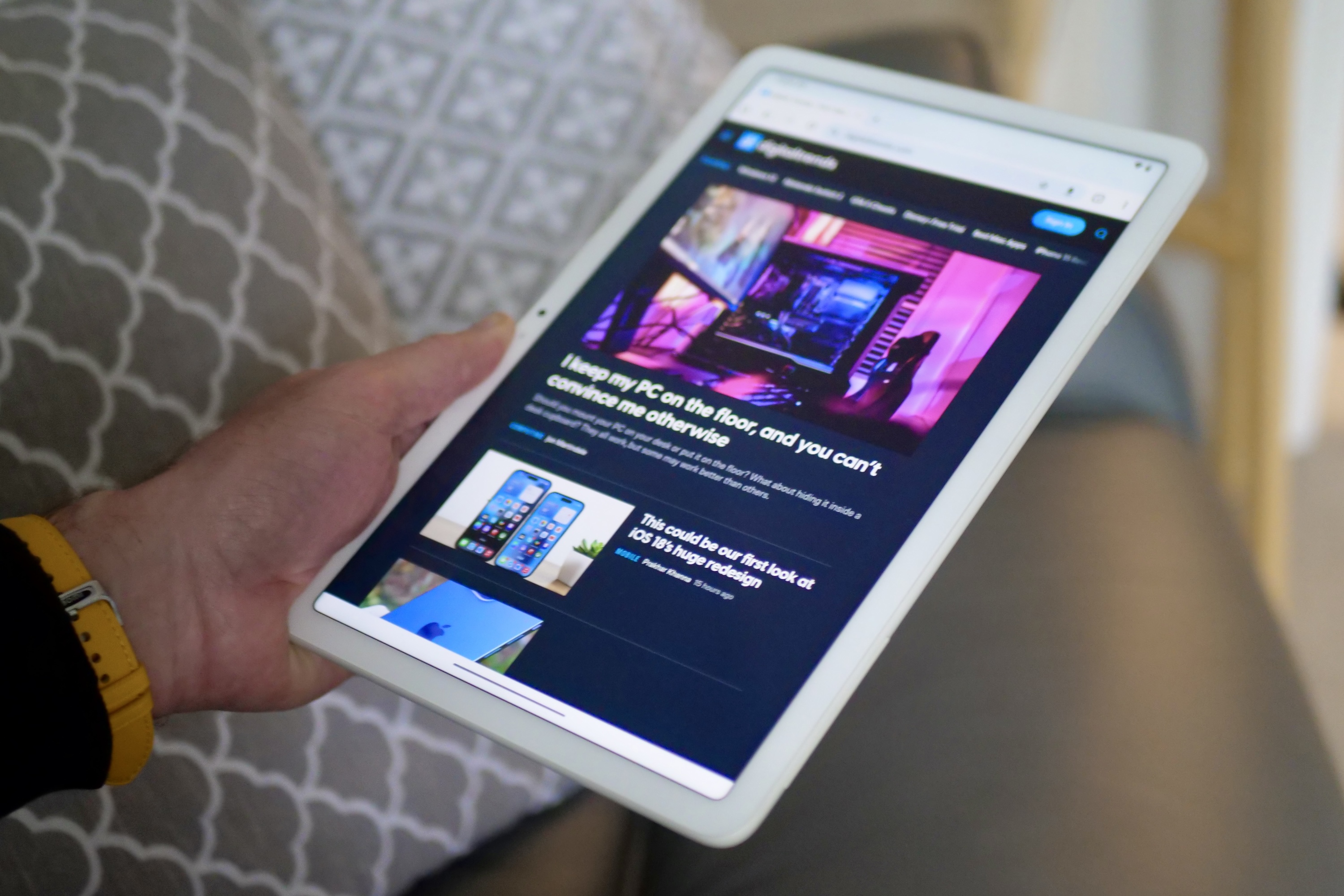 A person holding the Google Pixel Tablet.