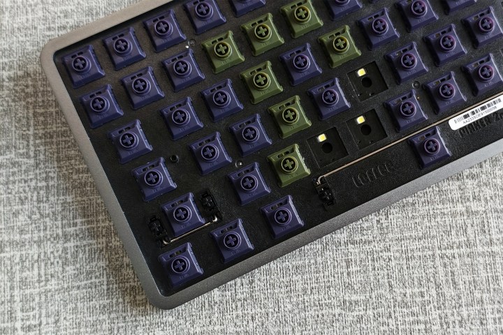 alt: Kailh Phantom tactile and Ghost linear switches on a desk.