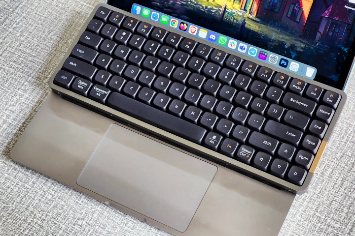 alt: Lofree Flow keyboard placed on a MacBook Pro.