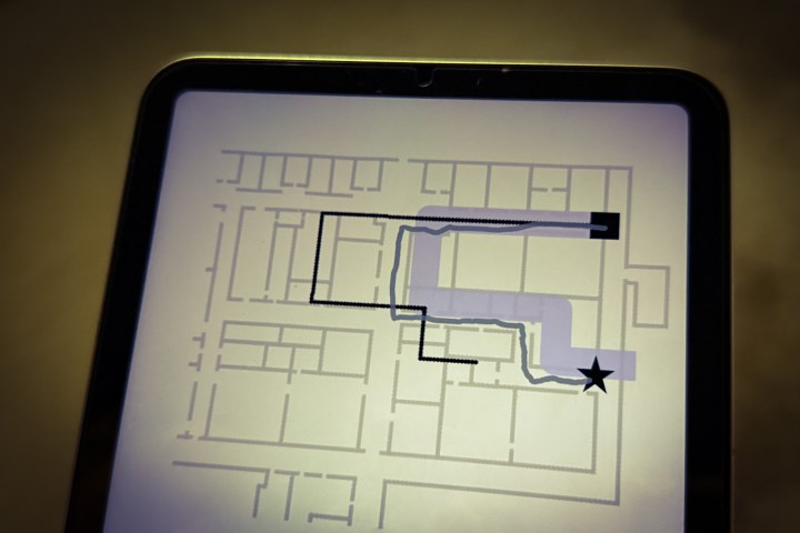 Alt: A visualization of a particle filtered map used for indoor navigation, showing the estimated user location and potential paths.