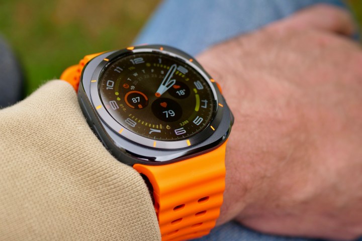 A person wearing the Samsung Galaxy Watch Ultra showing the Ultra Analogue watch face.