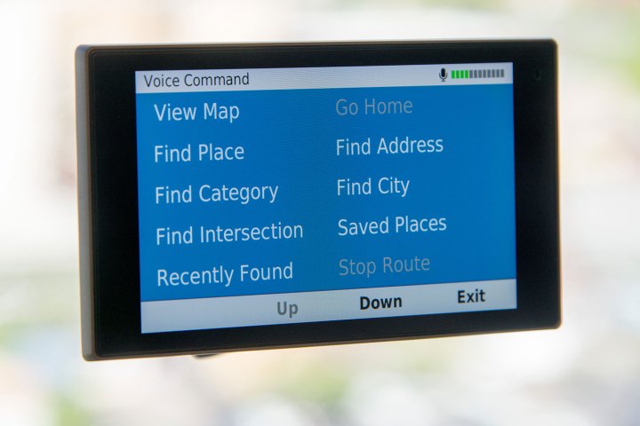 alt: A close-up view of a Garmin DriveLux GPS device displaying navigation information on its screen, highlighting the importance of accurate map data.