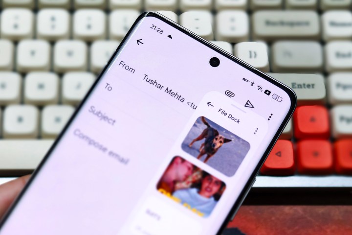 File Dock on Realme GT 6 held in hand in front of a white mechanical keyboard.