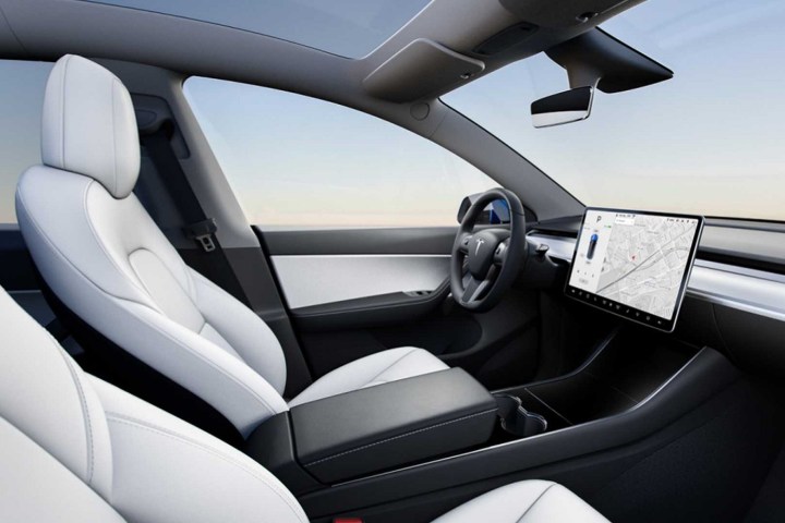 alt: Interior view of a Tesla Model Y showcasing the white seats option