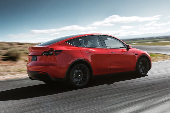 alt: Rear view of a Tesla Model Y highlighting its design and tailgate.