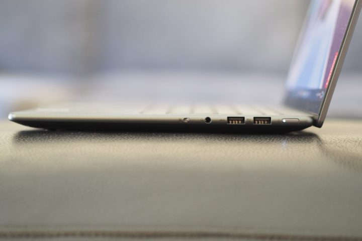 Lenovo Slim Pro 9i 14 side view showing ports and lid.