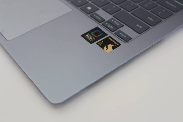 alt: Close-up of the badges on the Galaxy Book4 Edge, highlighting its features and integrations.