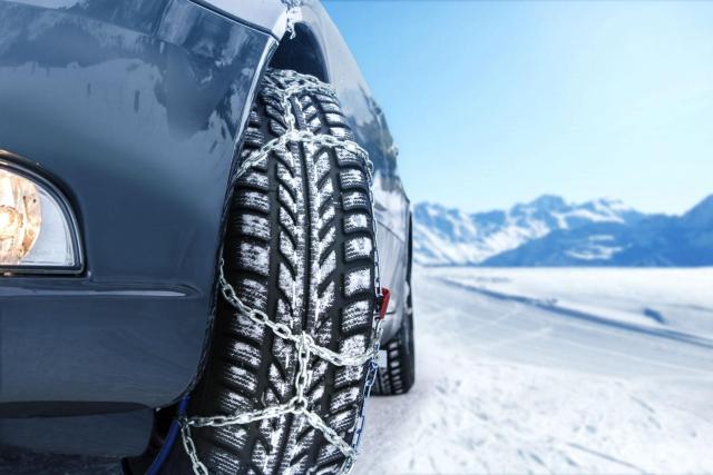 alt: Close-up of snow tires on a car