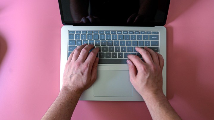 alt text: Someone typing on the Surface Laptop Studio 2's keyboard.