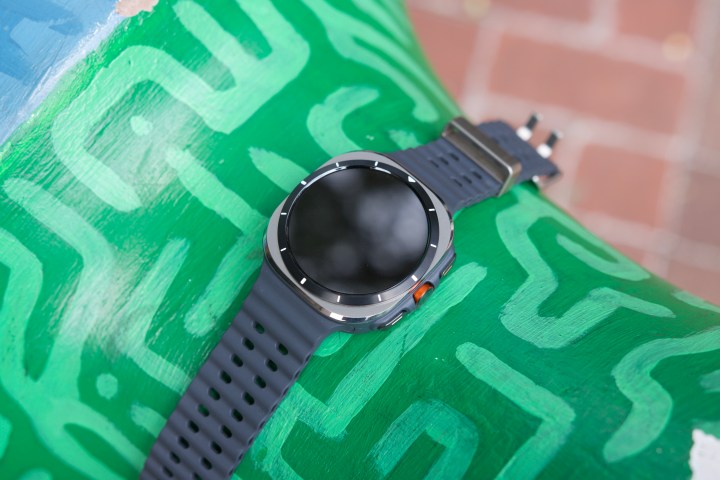 The Samsung Galaxy Watch Ultra displayed on a green sculpture.