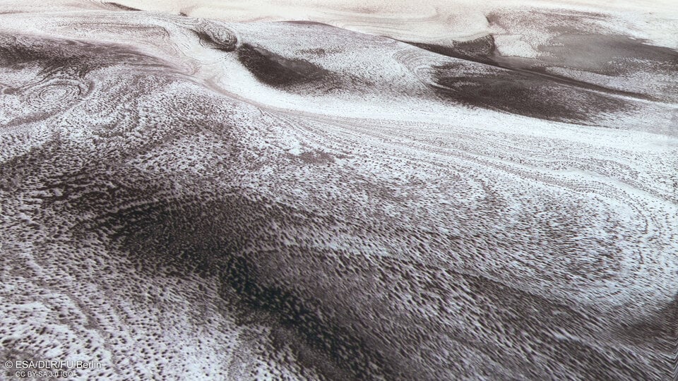 A view across icy hills in the Australe Scopuli region near the south pole of Mars. Credit: ESA/DLR/FU Berlin