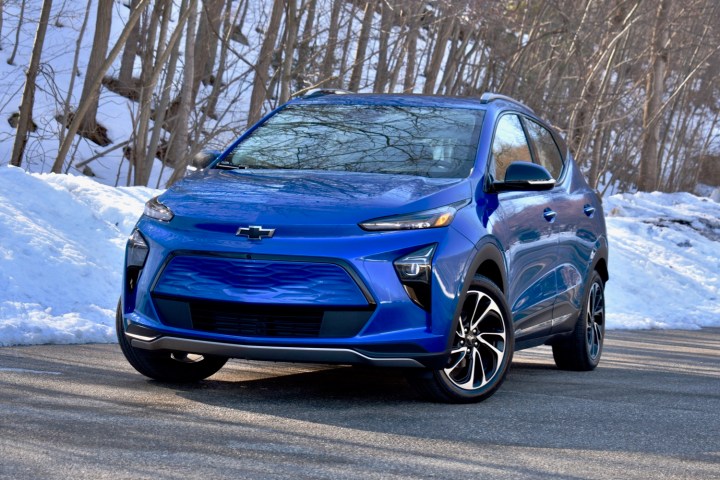 alt text: A blue Chevrolet Bolt EUV in a snowy landscape.