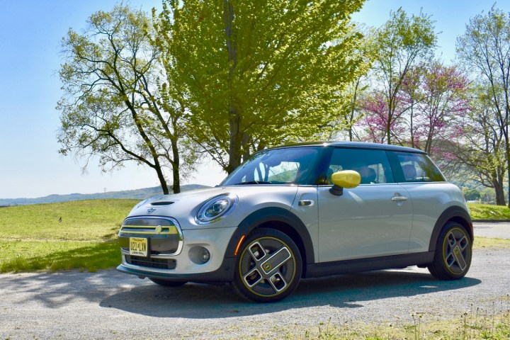 alt text: A silver Mini Cooper SE electric car.