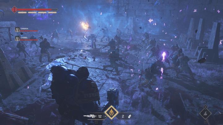 The image shows the player charging a group of Traitor Guardsmen.