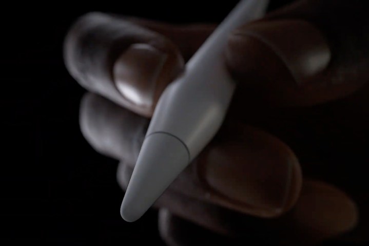 Close-up of tip of Apple Pencil Pro being held in a person