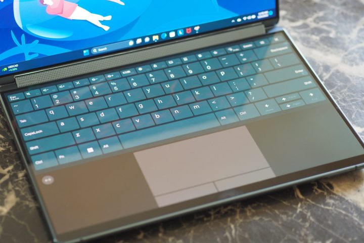 alt: Lenovo Yoga Book 9i with virtual keyboard and touchpad.